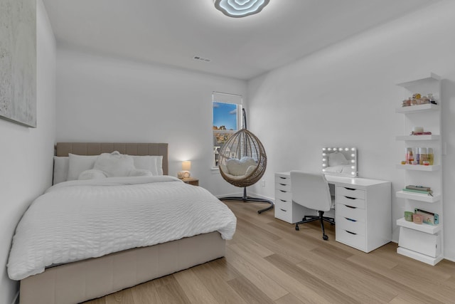 bedroom with light hardwood / wood-style floors