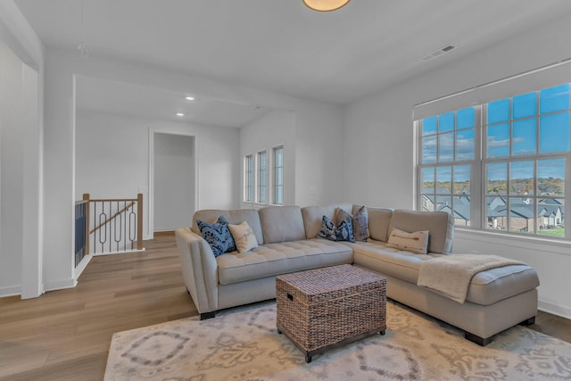 living room with light hardwood / wood-style flooring and plenty of natural light