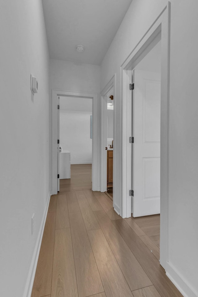 hallway featuring light hardwood / wood-style flooring