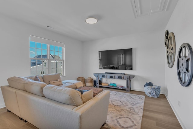 living room with light hardwood / wood-style flooring