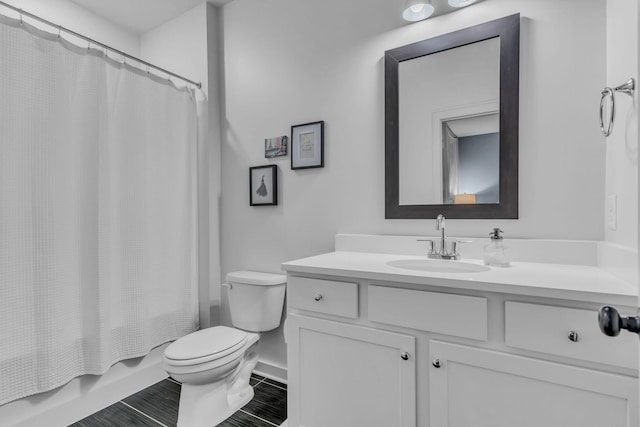 full bathroom featuring vanity, toilet, and shower / bath combo with shower curtain