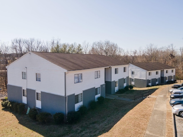 view of property exterior with a lawn