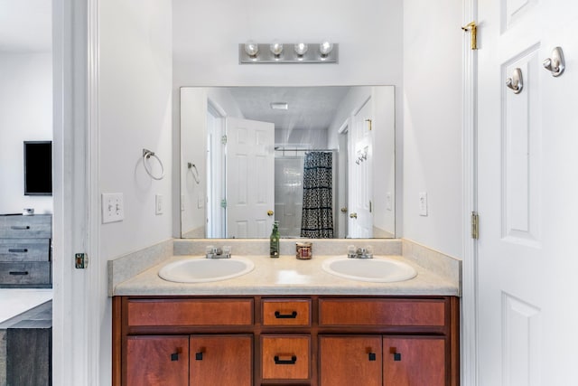 bathroom featuring vanity and a shower