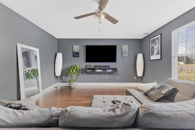 living room with hardwood / wood-style flooring and ceiling fan