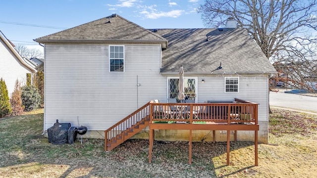 back of property featuring a wooden deck