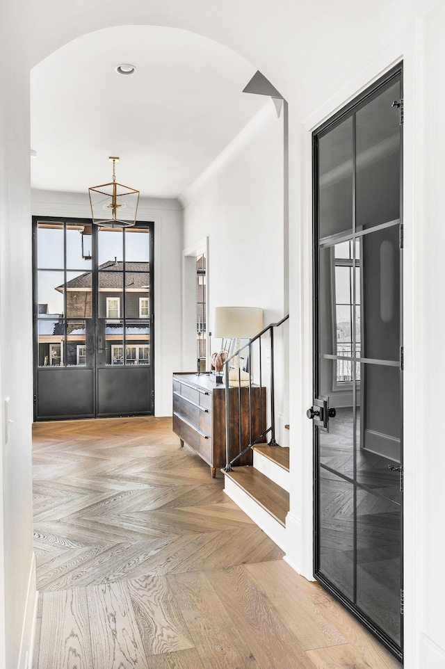 interior space with light parquet flooring and french doors