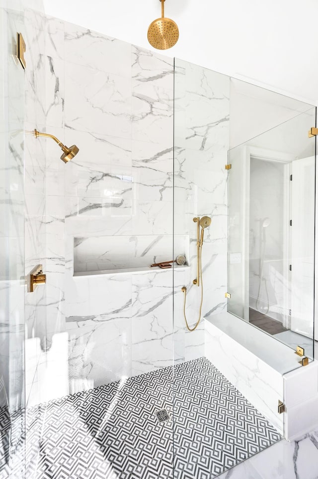 bathroom with a tile shower