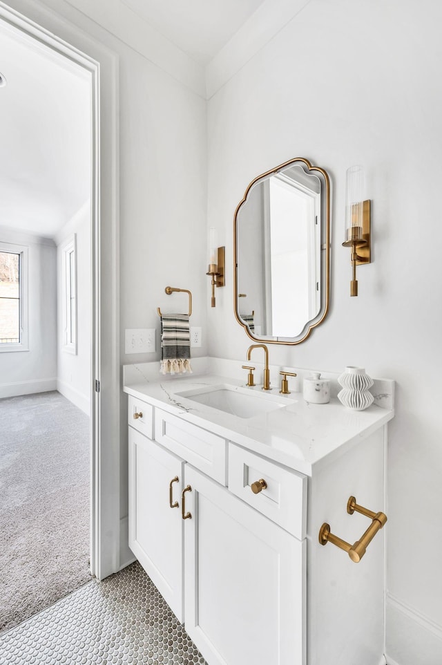 bathroom featuring vanity and ornamental molding