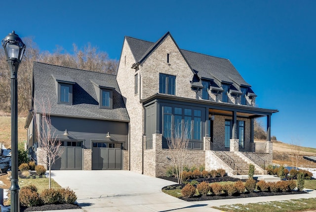 view of front of house featuring a garage and covered porch