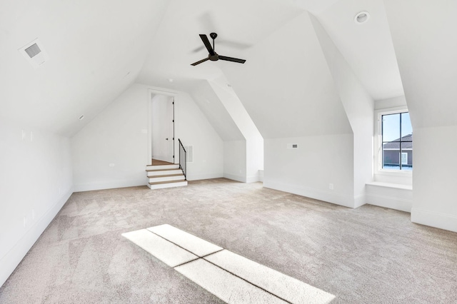 additional living space with lofted ceiling, light colored carpet, and ceiling fan