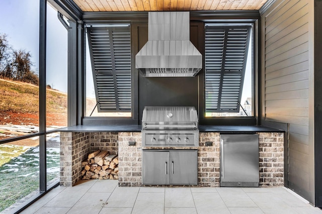 view of patio with exterior kitchen and grilling area