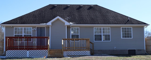 rear view of house with a wooden deck