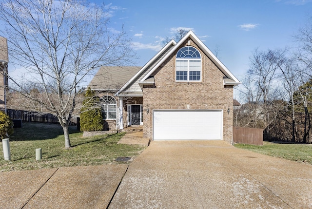 front of property with a garage and a front lawn