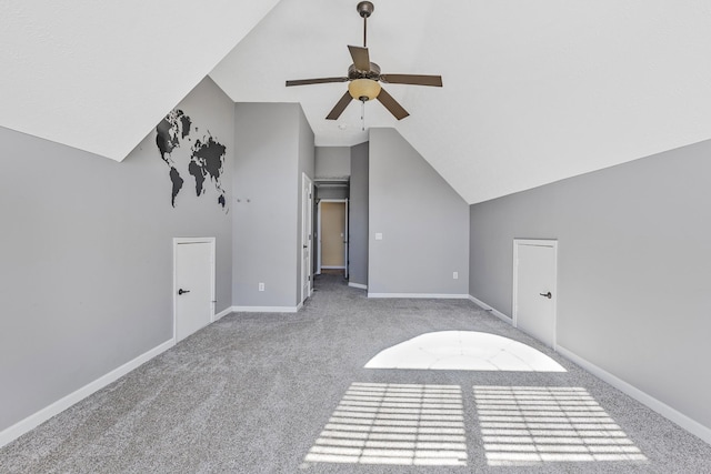 bonus room featuring high vaulted ceiling, light carpet, and ceiling fan