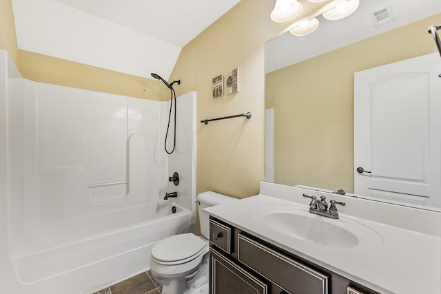 full bathroom featuring lofted ceiling, tile patterned floors, toilet, shower / bathing tub combination, and vanity