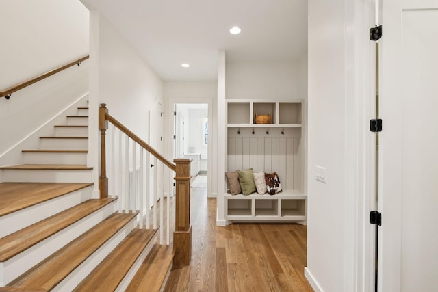 mudroom with light hardwood / wood-style floors