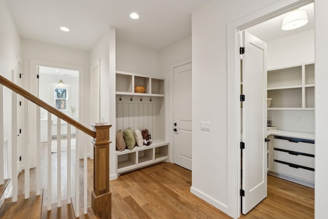 mudroom with hardwood / wood-style floors