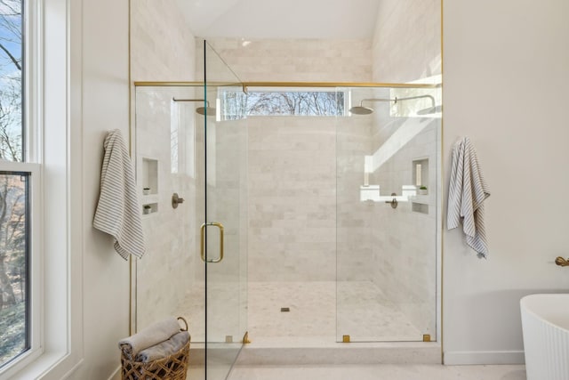 bathroom with shower with separate bathtub