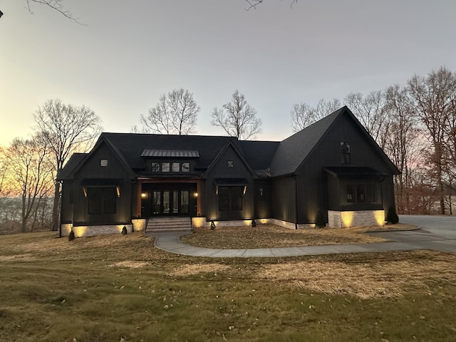 view of front of home with a yard