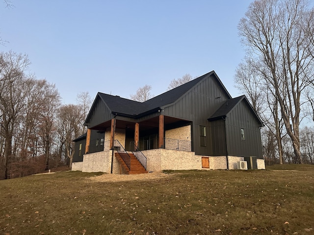 view of property exterior featuring a lawn