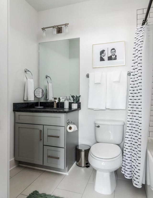 full bathroom with tile patterned flooring, vanity, shower / bath combination with curtain, and toilet