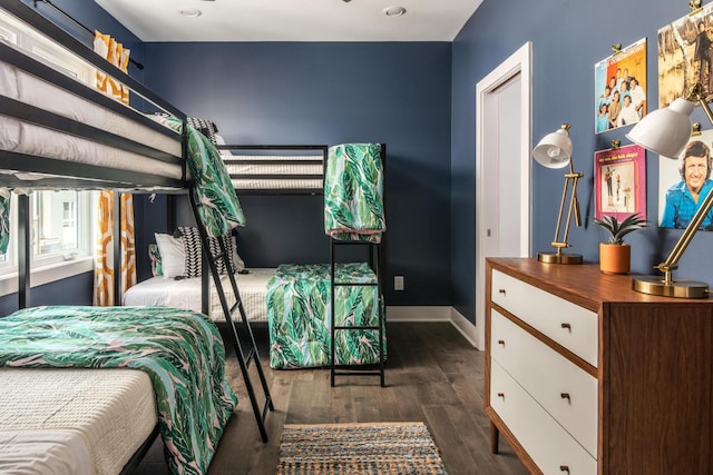 bedroom with dark wood-type flooring