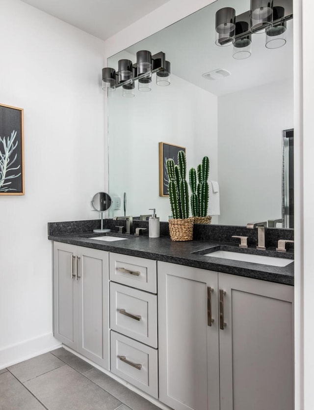 bathroom with vanity and tile patterned flooring