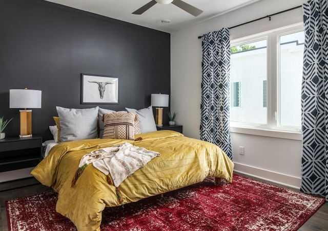 bedroom featuring hardwood / wood-style floors and ceiling fan