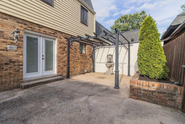 view of patio with a pergola and french doors