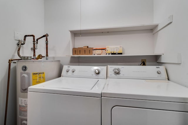 laundry area with independent washer and dryer and water heater