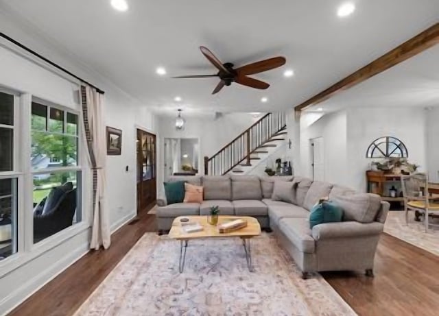 living room with dark wood-type flooring and ceiling fan