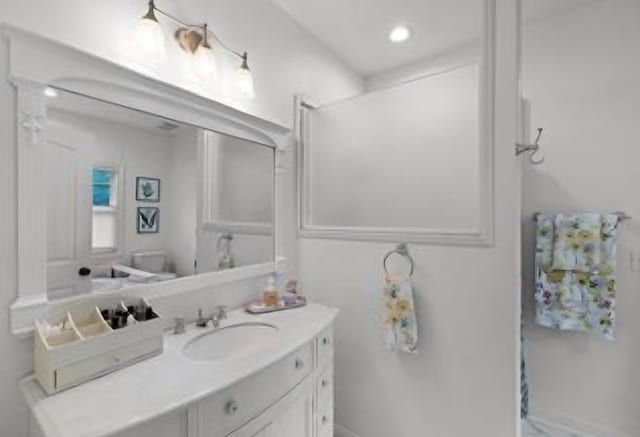 bathroom with vanity and toilet