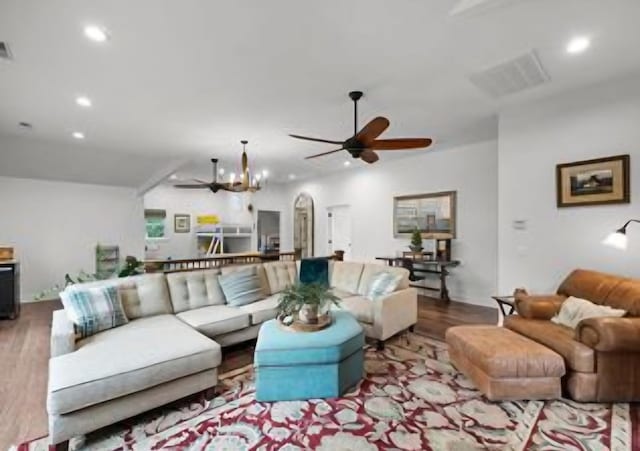 living room featuring ceiling fan and light wood-type flooring