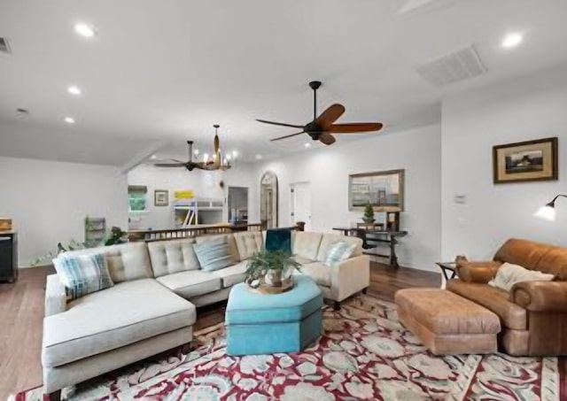 living room with ceiling fan and light wood-type flooring