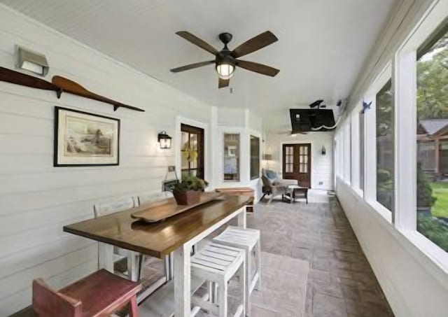 exterior space with ceiling fan and a healthy amount of sunlight