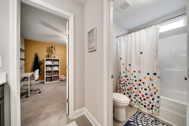 full bathroom featuring vanity, shower / bath combination with curtain, and toilet