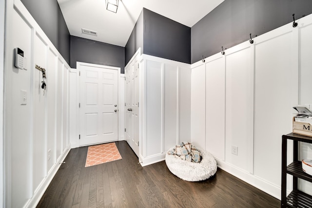 mudroom with dark wood-type flooring