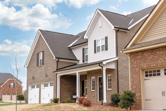 view of front property featuring a garage and covered porch