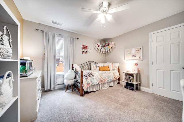 carpeted bedroom with ceiling fan