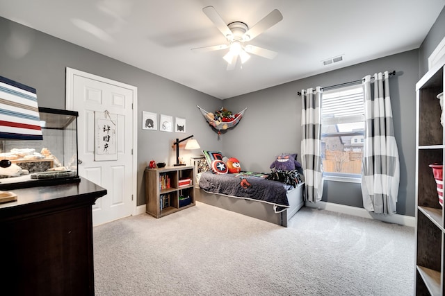 carpeted bedroom with ceiling fan