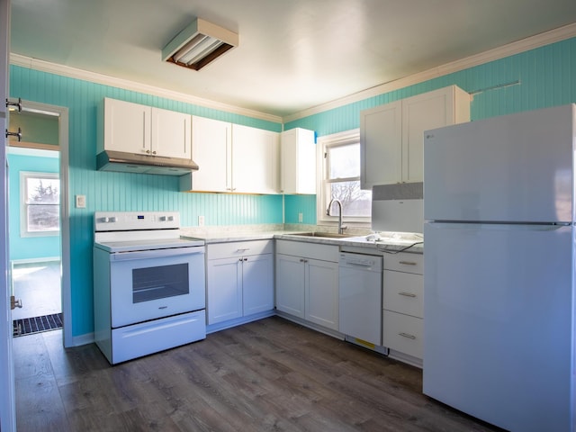 kitchen with white cabinetry, sink, crown molding, dark wood-type flooring, and white appliances