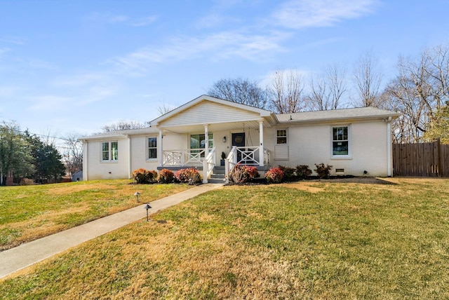 single story home featuring covered porch and a front lawn