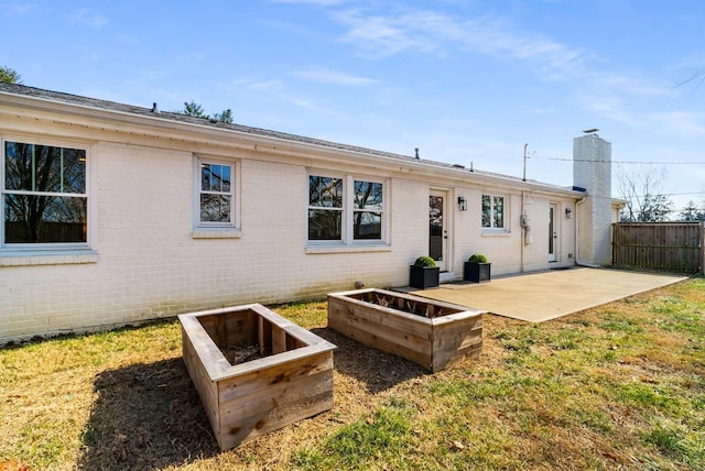 rear view of property featuring a patio area