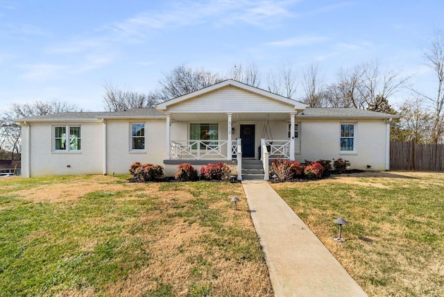 ranch-style home with covered porch and a front lawn