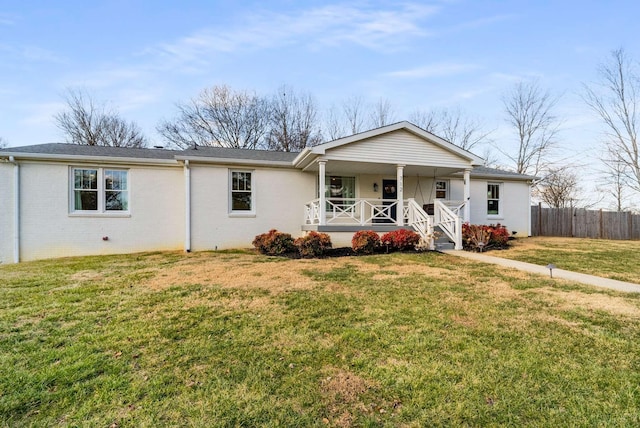 ranch-style house with a porch and a front yard