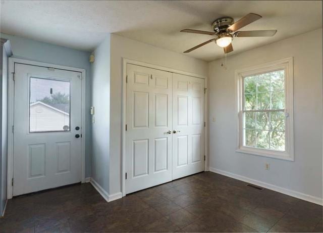 entryway with ceiling fan