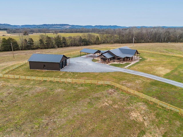 drone / aerial view with a mountain view and a rural view