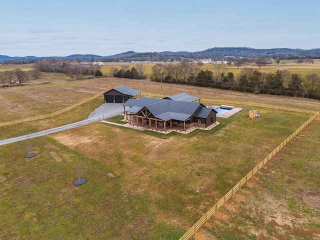 birds eye view of property with a rural view and a mountain view