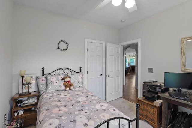 bedroom with light colored carpet and ceiling fan