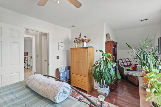 bedroom featuring ceiling fan and dark hardwood / wood-style flooring